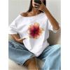 imageWomens Oversized Off The Shoulder Graphic Tees Letter Bow Print Short Sleeve T Shirt Y2K TopsOrange Flower